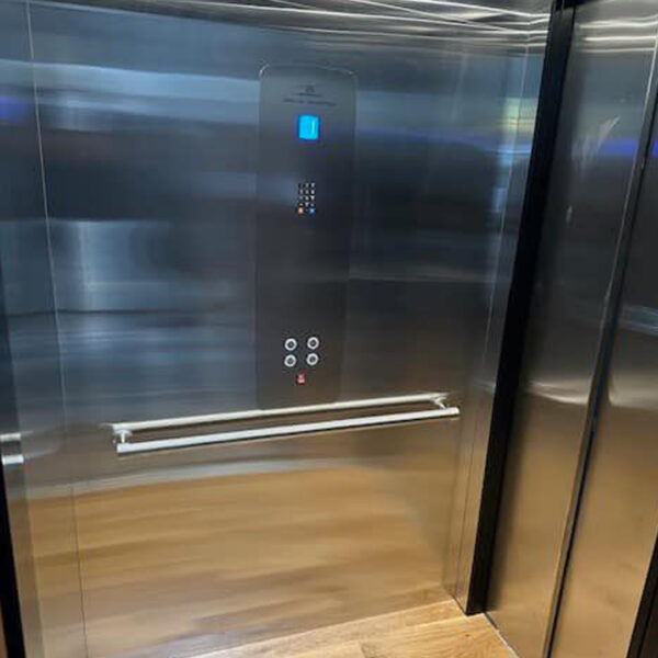 Crown Elevator home elevator installation in Upper Saddle River with Stainless cab and gate