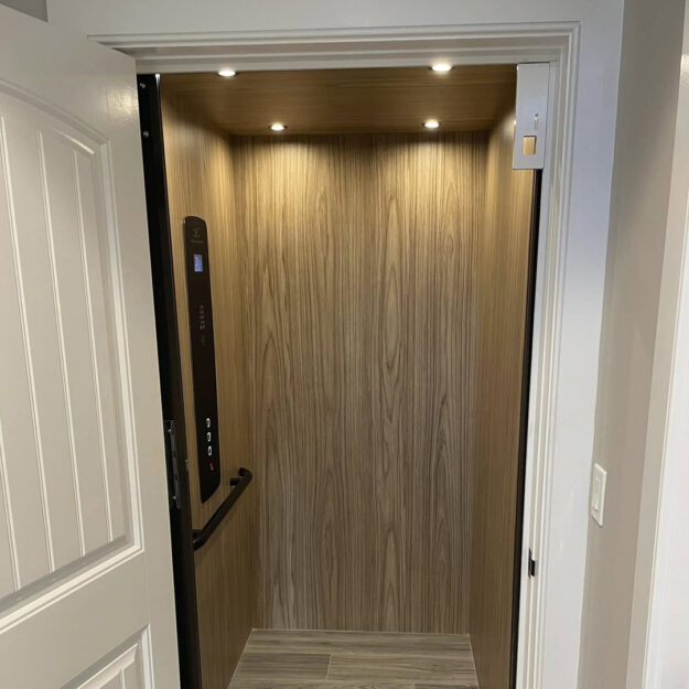 Crown Elevator Long Beach Island home elevator installation beachwood cab with black fixtures