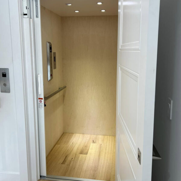 Crown Elevator New Jersey with interior home elevator in neutral colors and stainless steel controls