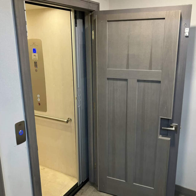 Raised Paneled door in white home elevator Avalon NJ by Crown Elevator