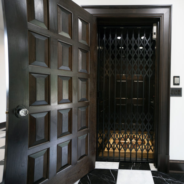 Waupaca residential elevator with custom panel door and floor